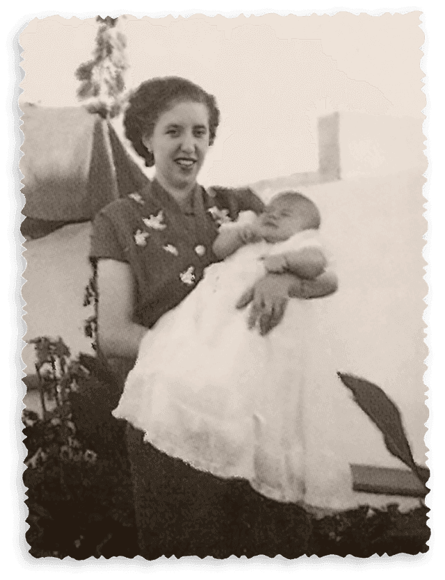 Alice Nabeiro holding João Manuel Nabeiro on her lap, 1954